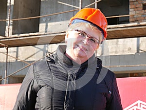 Feamle Engineer in the construction helmet