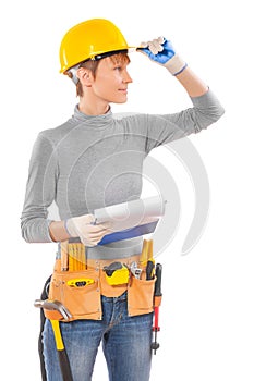 Feamle wearing working clothes with construction tools holding b photo