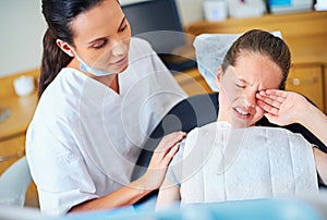 Fear, dental or crying girl with dentist in toothache consultation, problem or crisis. Pediatric dentistry, comfort or
