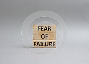 Fear of failure symbol. Concept words Fear of failure on wooden blocks. Beautiful grey background. Business and Fear of failure