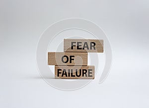 Fear of failure symbol. Concept words Fear of failure on wooden blocks. Beautiful gwhite background. Business and Fear of failure