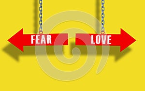 Fear or love choice . Red arrow hanged with metal chain. fear vs love concept. yellow background