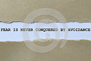 fear is never conquered by avoidance on white paper