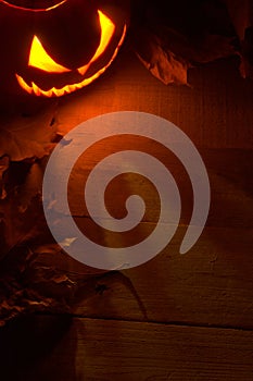 Fearful halloween red shadows background with lighting jack o lantern in the corner photo