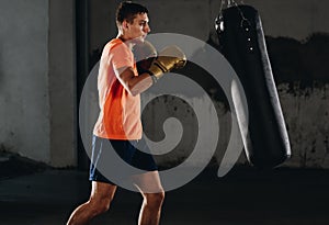 Fearles MMA Fighter practicing his punch on a punching bag