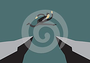 Fearless brave businessman jumping over a cliff to reach his tar
