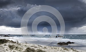 Fearsome giant storm cloud approaching coastline in Brittany, France