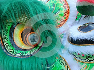Feather and art on Chinese lion mask