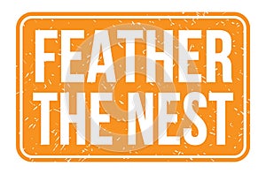 FEATHER THE NEST, words on orange rectangle stamp sign