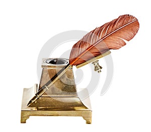 Feather pen with antique inkwell Isolated on white