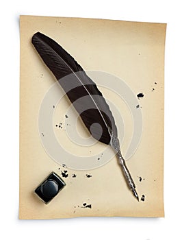 Feather quill and inkwell on an old paper