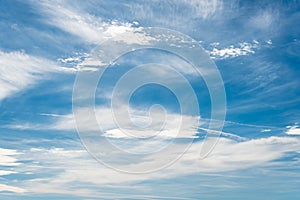 Feathery clouds in a bright blue sky