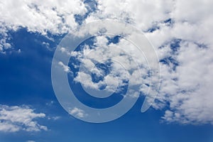 Feathery white clouds against a blue sky