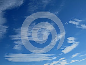 Feathery white clouds against blue sky