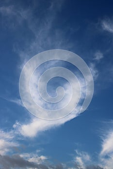 Feathery, wispy white cloud in a blue sky