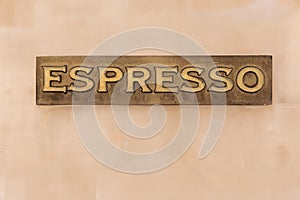 Featured view of vintage espresso in brass on a neutral background. Italian coffee