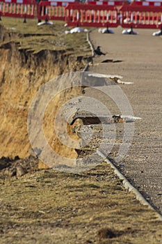 February 14 Storm Damage 2014, holes gauged out of tarmac asphalt seaside path, Milford on Sea