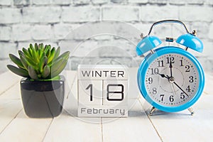 February 18 on the wooden calendar.The eighteenth day of the winter month, a calendar for the workplace. Winter