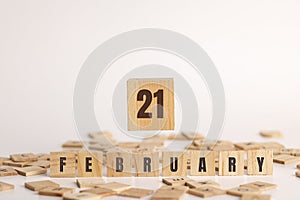 February 21 displayed wooden letter blocks on white background