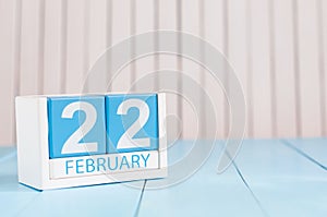 February 22nd. Day 22 of month, calendar on wooden background. Winter concept. Empty space for text