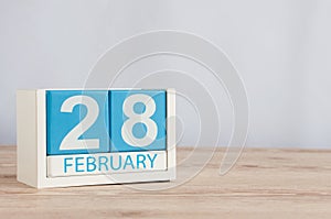 February 28th. Cube calendar for february 28 on wooden surface with empty space For text. Not Leap year or intercalary