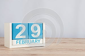 February 29th. Cube calendar for february 29 on wooden surface with empty space For text. Leap year, intercalary day