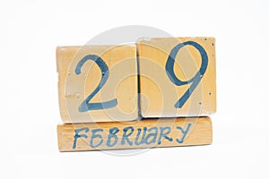 February 29th. Day 29 of month, handmade wood calendar isolated on white background. Winter month, day of the year concept.
