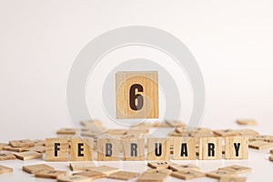 February  6 displayed wooden letter blocks on white background