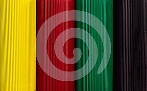 February Black History Month. Abstract corrugated paper geometric black, red, yellow, green background. Copy space