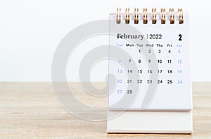 February calendar 2022 on wooden table photo