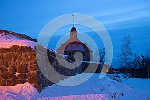 The February evening at the ancient tower of Lars Torstenson. Fortress Korela, Russia