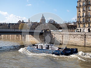 February 17, 2020. Paris, France. Police boat on the river Seine in Paris. Full speed ahead