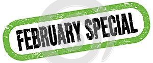 FEBRUARY SPECIAL, text written on green-black stamp sign