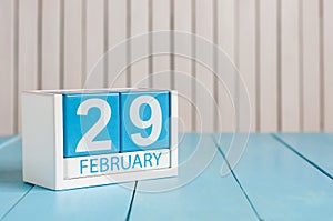 February 29th. Cube calendar for february 29 on wooden surface with empty space For text. Leap year, intercalary day