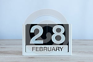 February 28th. Cube calendar for february 28 on wooden table with empty space For text. Not Leap year or intercalary day photo