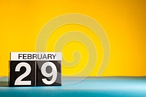 February 29th. Day 29 of february month, calendar on yellow background. Winter time, leap-year. Empty space for text photo