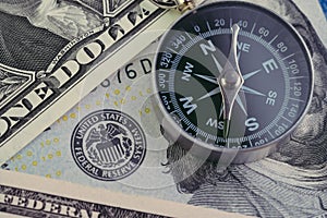 FED, Federal Reserve of US government direction on interest rate concept, compass on US Dollar banknote with Feral Reserve emblem