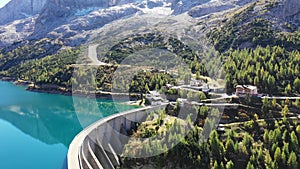 The Fedaia lake dam (Fedaia lake), an artificial lake near Canazei, located at the foot of Marmolada massif, Dolomites, Trentino.