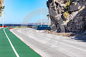 Bikeway along federal highway 11 towards del Ruso viewpoint, sea against blue sky background photo