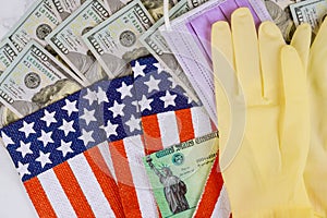 Federal monetary assistance stimulus U.S. economic tax return check USA dollar cash banknote on American flag Global pandemic