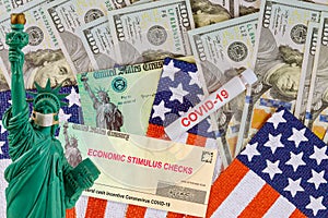 Federal STIMULUS RELIEF PROGRAM individual checks virus economic stimulus plan US 100 dollar bills currency on American flag