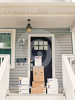 FedEx boxes on front porch