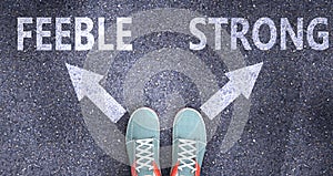 Feeble and strong as different choices in life - pictured as words Feeble, strong on a road to symbolize making decision and