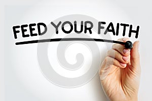 FEED YOUR FAITH underlined text with marker, concept background