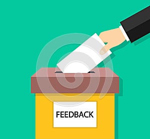 Feedback box. Hand holding paper card for feedback. Icon of suggestion. Poll and suggest for customer. Submission of comment in photo