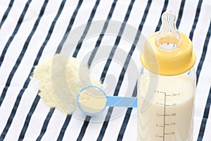 Feeder bottle and dried milk photo