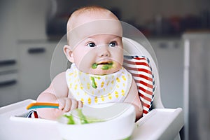 Feeding. Baby`s first solid food