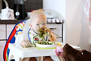 Feeding. Baby's first solid food.