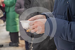 Feeding homeless military refugees who fled their homes during the bombing of civilians