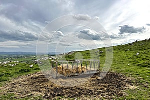 Feeding pen, high on Malham Moor, on a cloudy day near, Malham, Yorkshire, UK